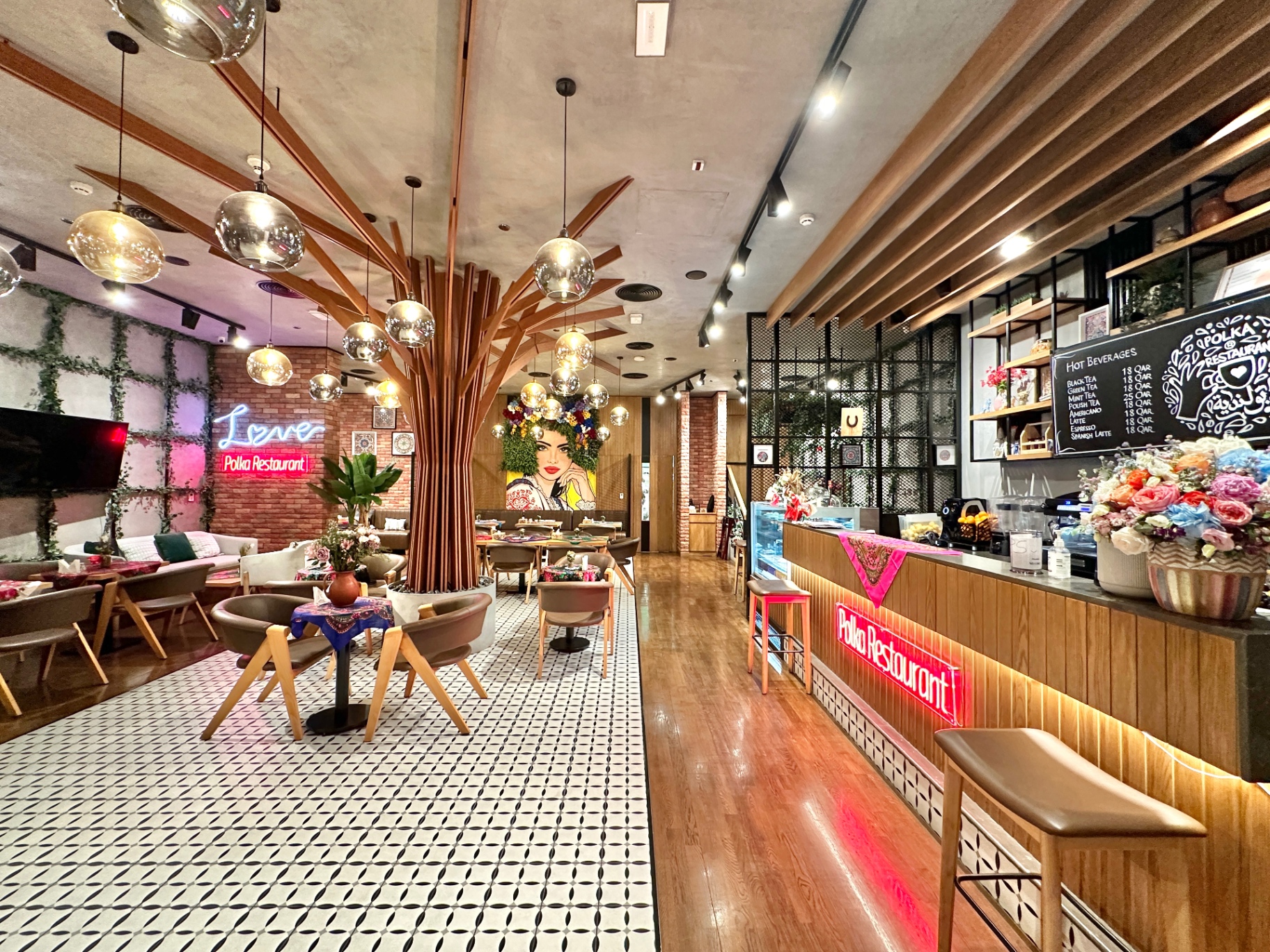 Polka Restaurant interior with folk mural and warm lighting